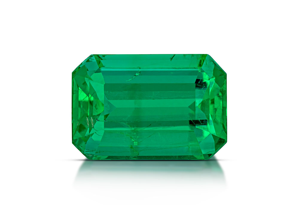Vibrant green emerald on white background