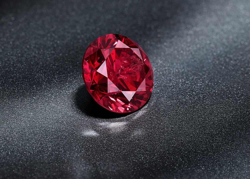 red oval diamond on black background